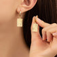 SUNRAY CHARM BRASS HUGGIE HOOP EARRINGS